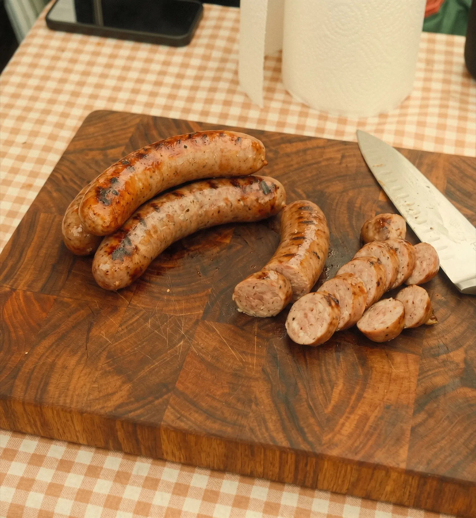 Grilled sausages on a wooden board at the Waterhouse Farm store