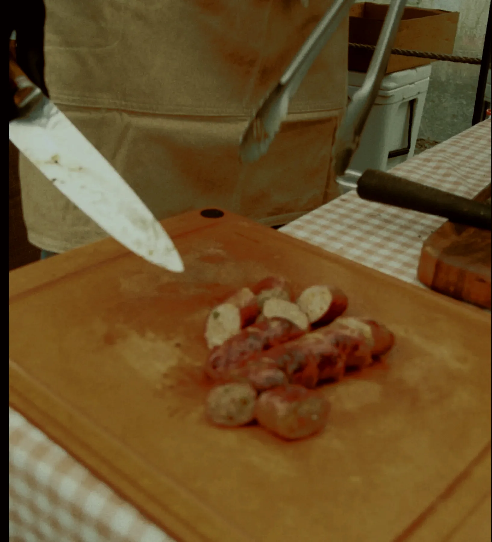 Sliced sausages being served at the farm table